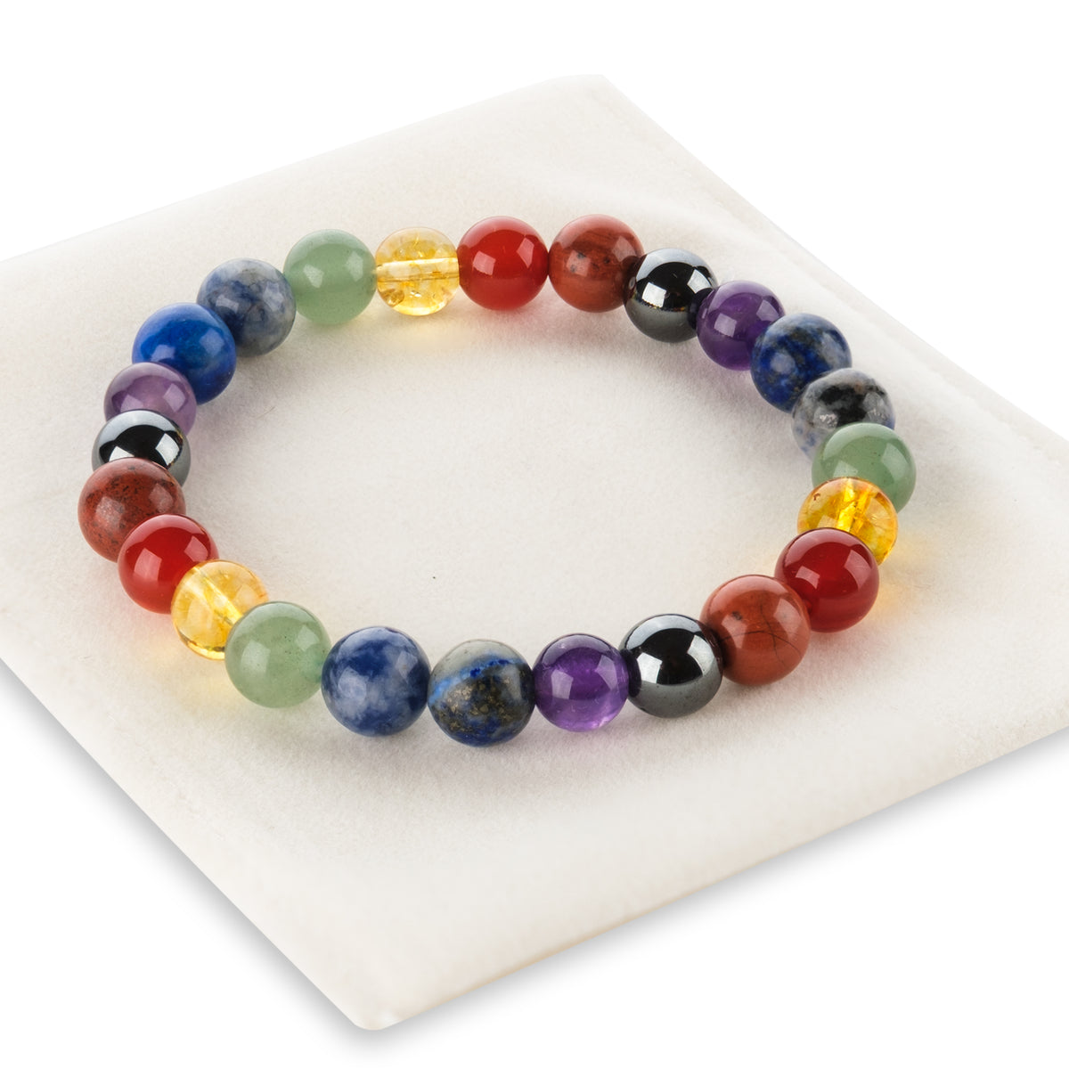 Multicolored beaded bracelet on a white plate