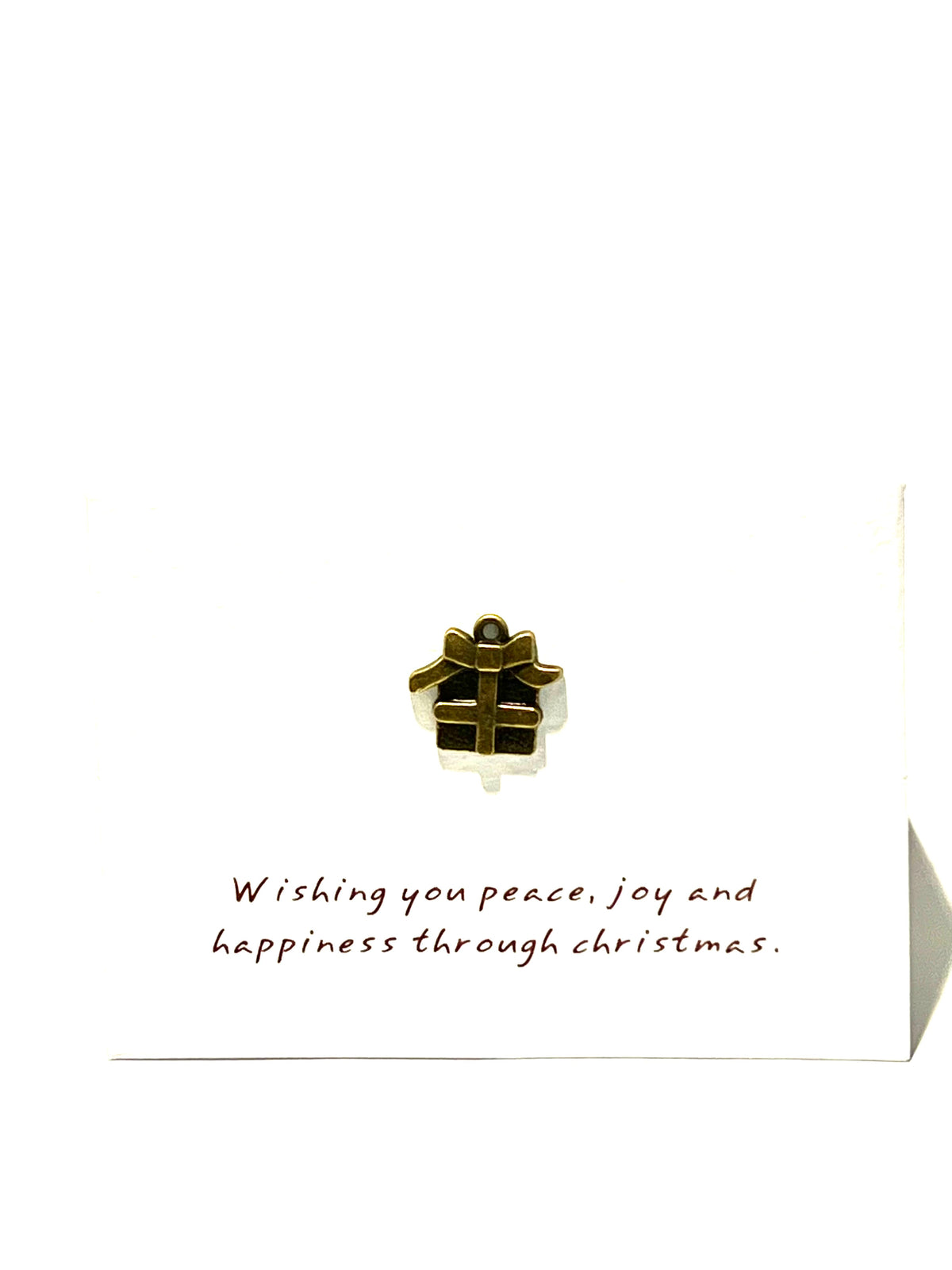 Christmas card with a gold gift box charm and festive message on a white background