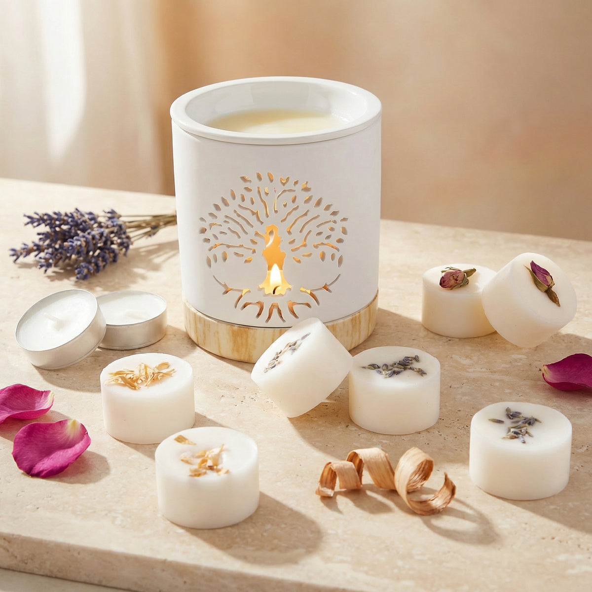 White wax melts with decorative elements on a wooden surface, featuring a lit candle in the center.