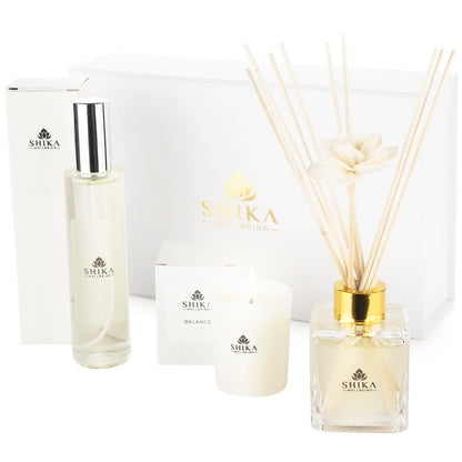 Shika diffuser, candle, and bottle on a white background