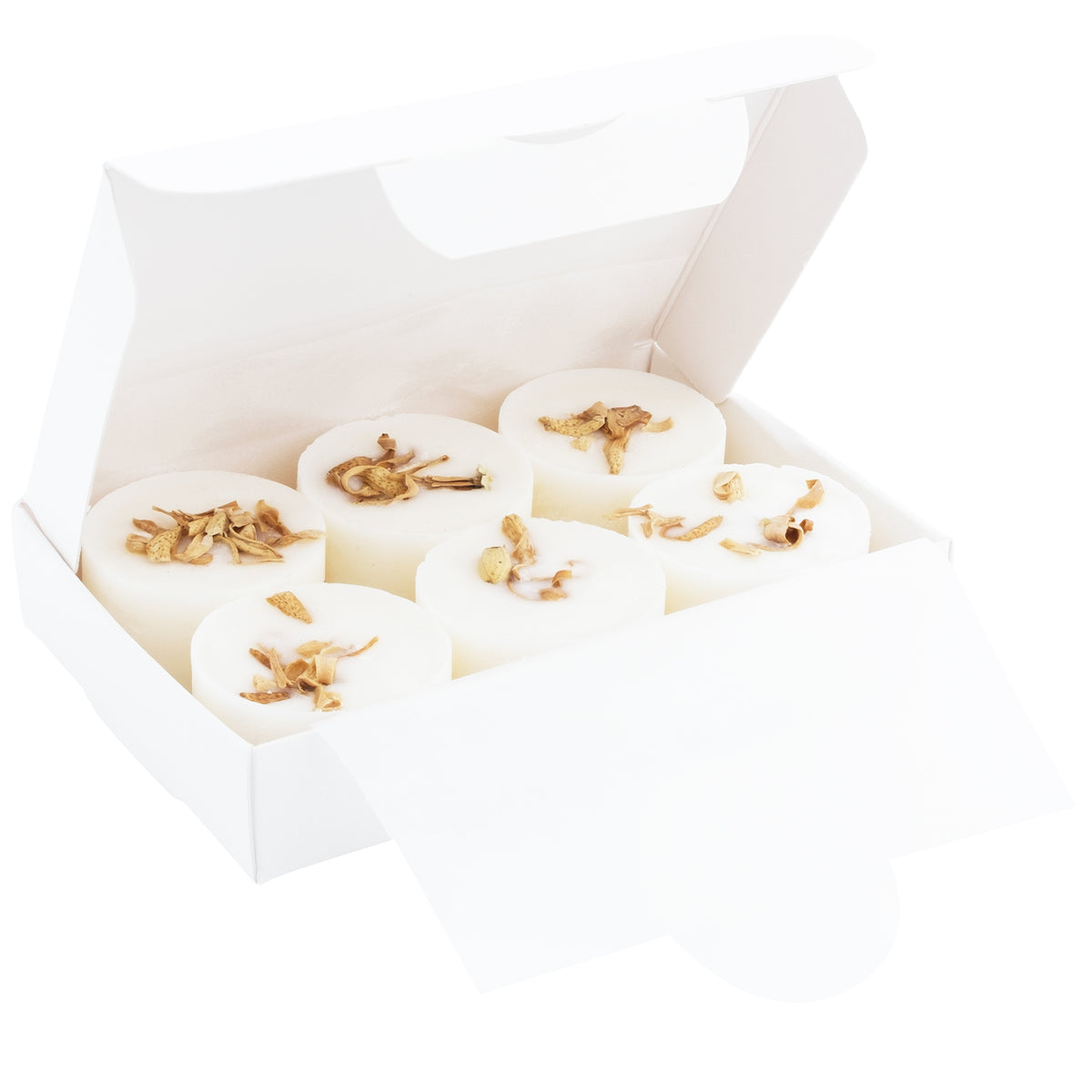White soap bars with gold flakes in a white box on a white background