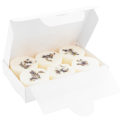 Box of white cookies with lavender sprinkles on a white background