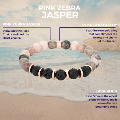 Bracelet with pink zebra jasper, rose gold alloy, and lava rock on a beach background