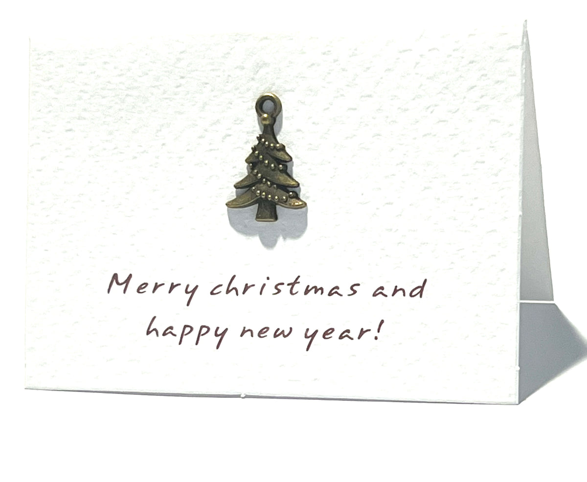 Christmas card with a small Christmas tree ornament and 'Merry Christmas and happy new year!' text.