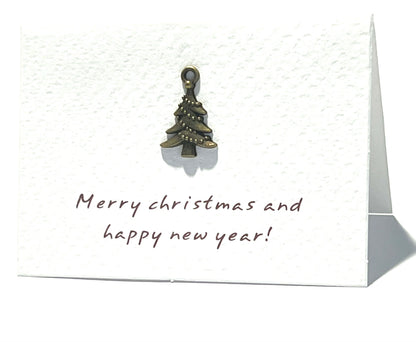 Christmas card with a small Christmas tree ornament and 'Merry Christmas and happy new year!' text.