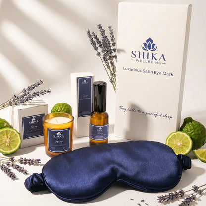 SHIKA Wellbeing satin eye mask with lavender, lime, and essential oil products on a neutral background