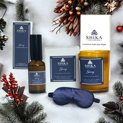 Shika wellness products including a candle, eye mask, and other items on a decorative background.