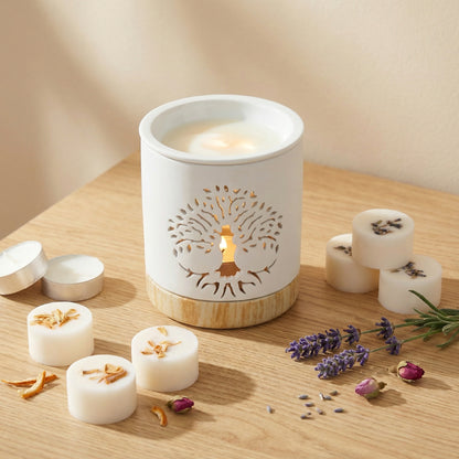 White wax melts with tree design on a wooden surface, surrounded by small containers and lavender flowers.