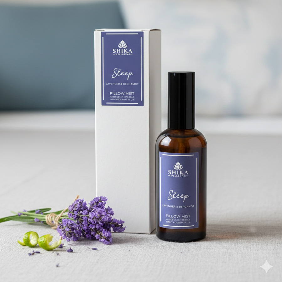 Shika Sleep Pillow Mist bottle and packaging with lavender flowers on a neutral background